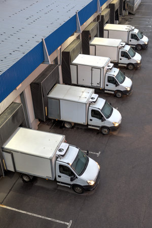 Saint-Petersburg, Russia - October 31, 2016: Top viev row of trucks at a loading dock.