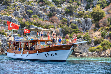 Antalya, Turkey - 28 august, 2014: Small cruise vessel with many tourist on Mediterranean sea, sightseeing excursion, Kekova island boat tour.のeditorial素材
