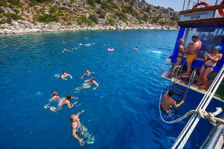 Antalya, Turkey - 28 august, 2014: Passengers pleasure boat bathed in the waters of the Mediterranean Sea during a sightseeing walk.のeditorial素材