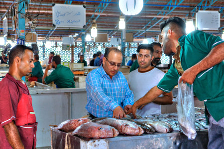 Bandar Abbas, Hormozgan Province, Iran - 16 april, 2017: The Iranian buys fish in the fish market.のeditorial素材