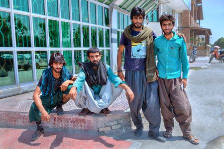 Bandar Abbas, Hormozgan Province, Iran - 16 april, 2017: A group of young Afghan men in an Iranian city.のeditorial素材