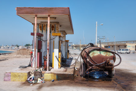 Hormuz Island, Hormozgan Province, Iran - 17  april, 2017: A rusty tank stands near a small petrol station.のeditorial素材