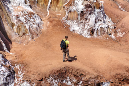 Hormuz Island, Hormozgan Province, Iran - 17  april, 2017: Iranian Island of Ormuz in Persian Gulf, Barren soil salt mountains, tourist walks around the salt glaciers rainbow island.のeditorial素材