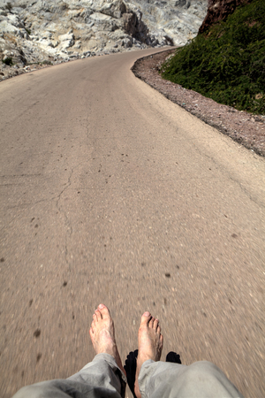 Human foot over the road, Hormuz Island, Hormozgan Province, Iran.の写真素材