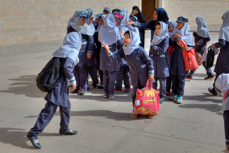 Fars Province, Shiraz, Iran - 19 april, 2017:  A group of girls in primary school during a hike on an excursion to the city.のeditorial素材