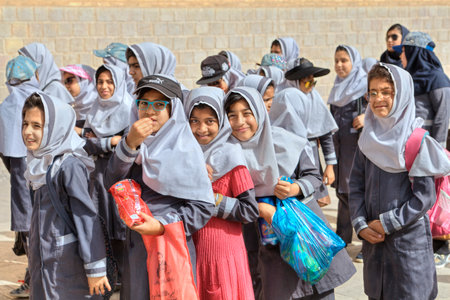 Fars Province, Shiraz, Iran - 19 april, 2017: Iranian schoolgirls expect the beginning of the excursion at the walls of the ancient fortress.のeditorial素材