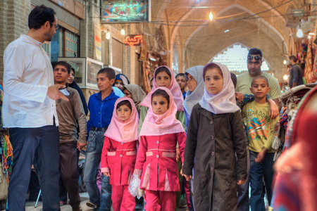 Fars Province, Shiraz, Iran - 19 april, 2017: Iranian group of primary school children visited market or Vakil Bazaar.のeditorial素材