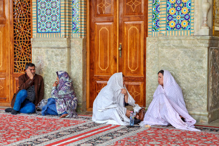 Fars Province, Shiraz, Iran - 19 april, 2017: Shah Cheragh Shrine,  iran shrine, shiraz shrine, muslim pilgrims are sitting in the courtyard.のeditorial素材