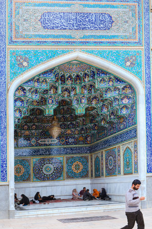 Fars Province, Shiraz, Iran - 19 april, 2017: Shah Cheragh Shrine, muslims are sitting on a carpet...