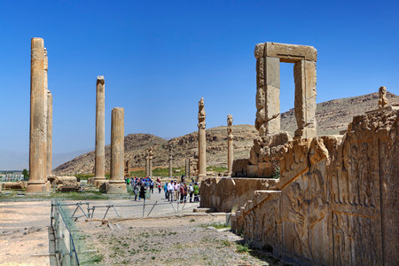 Fars Province, Shiraz, Iran - 20 april, 2017: Tourists walk around the ruins of the ancient Persian city of Persepolis  in the open air.のeditorial素材