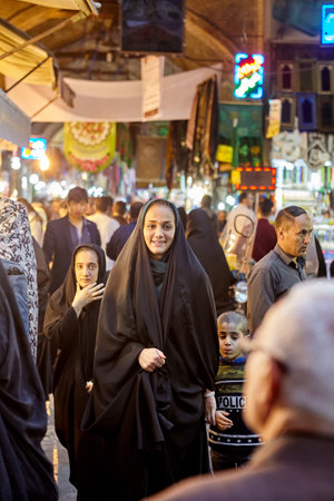 Tehran, Iran - April 27, 2017: Iranian woman in hijab stands in the Oriental bazaar near Shahr-e-Rey metro station and smiles.のeditorial素材