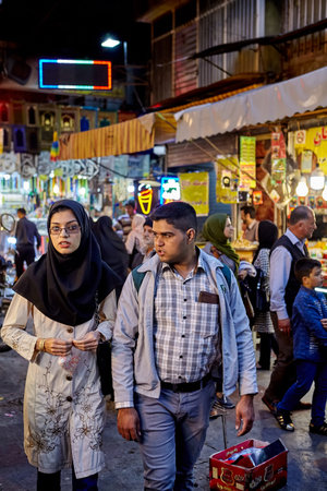 Tehran, Iran - April 27, 2017: Iranian man and woman in religious veil walk on Oriental bazaar near Shahr-e-Rey metro station.のeditorial素材
