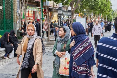 Tehran, Iran - April 27, 2017: Iranian women in hijabs walk along the street of Shahre Rey area.のeditorial素材