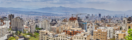 Tehran, Iran - April 28, 2017: panorama of the city with high-rise buildings and building cranes against the backdrop of the mountains.のeditorial素材