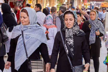 Tehran, Iran - April 29, 2017: Women in hijabs walking in a street crowd near Tehran Grand Bazaar.のeditorial素材