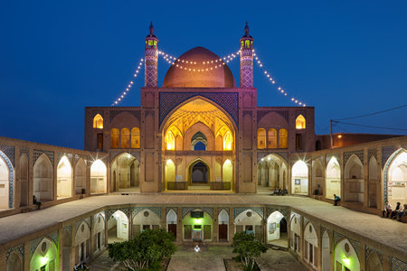 Kashan, Iran - April 25, 2017: Agha Bozorg mosque, ground level view of sunken courtyard at night.のeditorial素材
