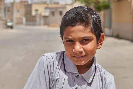Kashan, Iran - April 27, 2017: Close-up portrait of an unknown Iranian boy, about 12 years old,...