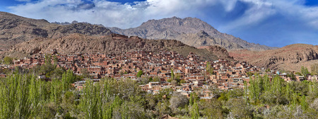 Houses in Abyaneh red village is built of red mud brick by surrounding mountain terrain, Iran.の写真素材