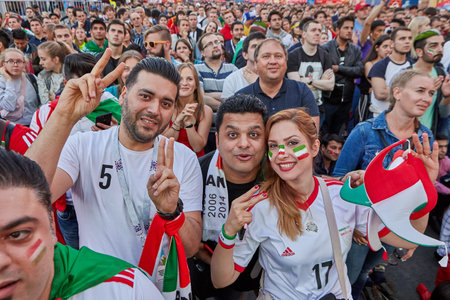 St. Petersburg, Russia - June 25, 2018: Fifa fan fest, Mundial 2018, Iranian fans of Iranian national football team cheer during  World Cup football match, between teams of Iran and Portugal.のeditorial素材