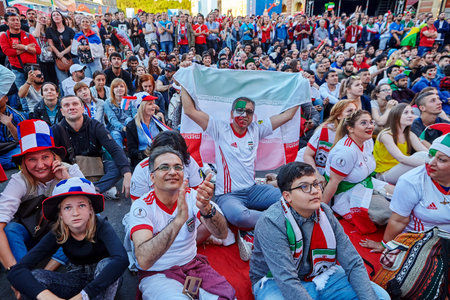 St. Petersburg, Russia - June 25, 2018: Iranian football supporters watch soccer match on giant screen during game of National Team of Iran in 2018 World Cup.のeditorial素材