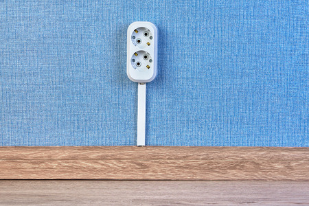 New electrical outlet socket connected with frool with help of cable channel.の写真素材
