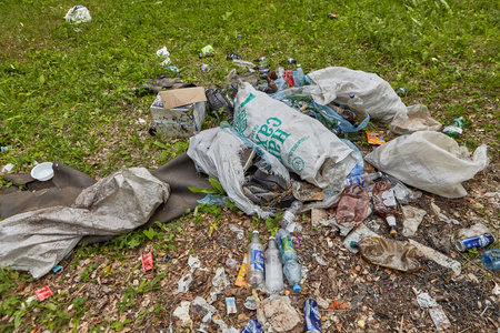 St. Petersburg, Russia - June 30, 2019: Environmental crime, domestic waste problems, criminals...