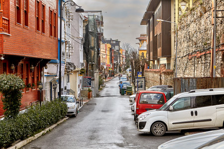 Istanbul, Turkey - February 11, 2020: Kutlugun Street is a tourist destination with many hotels and restaurants, parked cars spoil the view, interfere with the passage of people and transport.のeditorial素材
