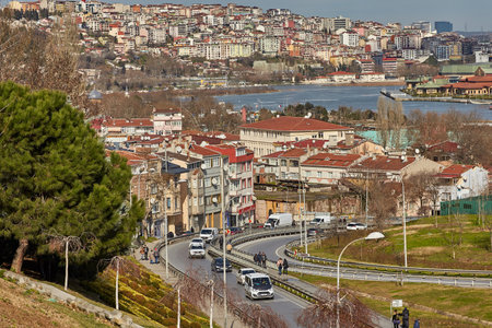 Istanbul, Turkey - February 12, 2020: View of Alaca Tekke Street in Eyupsultan area and the Golden Horn Bay with Sutluce neighborhood, Beyoglu district on the opposite bank.のeditorial素材
