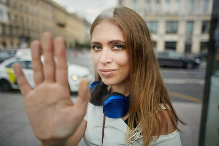 Attractive woman with earphones outdoors. Caucasian white beautiful female about 25 years old with...