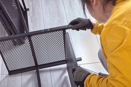Assembly of metal cabinet with storage shelves or television stand.