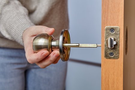 Installation of a handle with a latch lock for an interior door.の写真素材