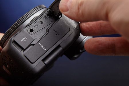 St. Petersburg, Russia - January 9, 2021: Audio and remote connectors of camera Canon EOS R6 are...