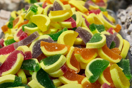 Slide from Turkish delights in a candy store consists of marmalade in the form of slices of citrus fruits.の写真素材
