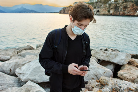 Antalya, Turkey opened tourist season during  , Caucasian individual tourist uses face mask as PPE.