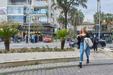 Young woman ignores an instruction to wear face mask in public, Antalya, Turkey.のeditorial素材