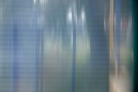 Texture of matte translucent plexiglass with stripes, glare, and reflections.