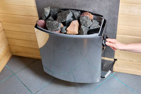 Electric steam sauna heater with stones is modern high performance stove.の写真素材