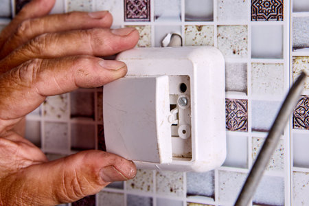 Repair of wall light switch at home.