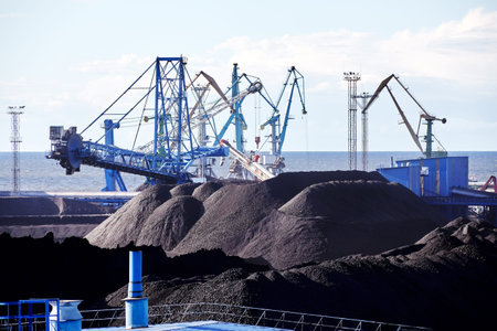 At dry bulk terminal combined machine for stacking.and reclaiming, stacker reclaimer, to handle of...