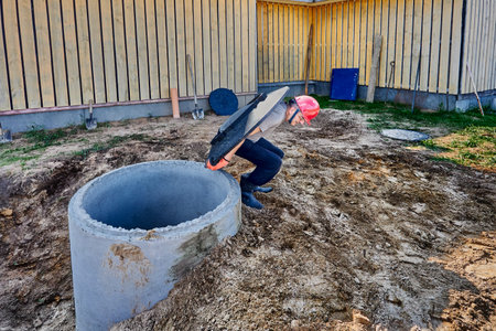 Septic tank made of concrete rings installation for discharge of wastewater.