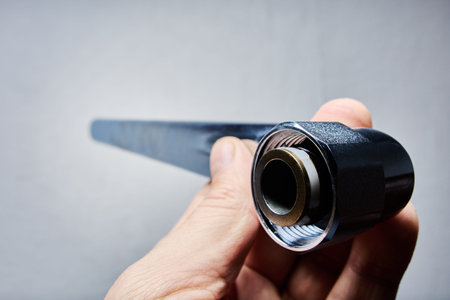 Long water tap spout for bath features chrome plated finish, durable threaded joint, and sealing gasket for reliable water flow and easy plumbing installation.の写真素材