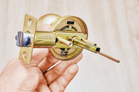 Door handle mechanism featuring bolt action, spindle, latch system and functional parts in closeup...