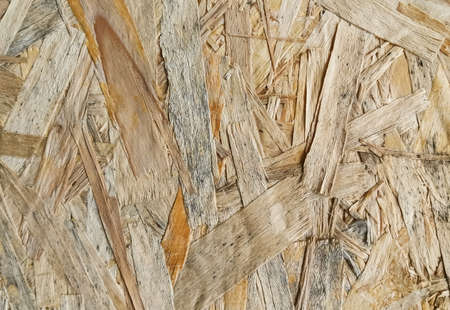 Yellow background surface of compressed yellow wood splinters and sawdustの写真素材