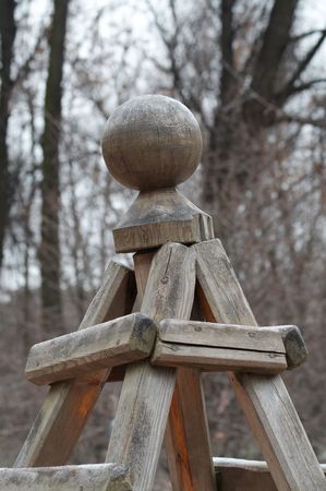 Strange wooden design with a sphereの写真素材