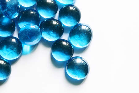 Blue glass spheres on whiteの写真素材