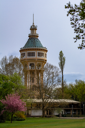 On Margaret Island in Budapest, Hungary is a historic water tower surrounded by treesの写真素材