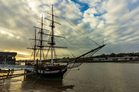 New Ross, Ireland - January 22, 2019 - A replica of the Dunbrody Famine Ship is moored on the banks of River Barrow. It is a popular tourist attraction in the town.のeditorial素材
