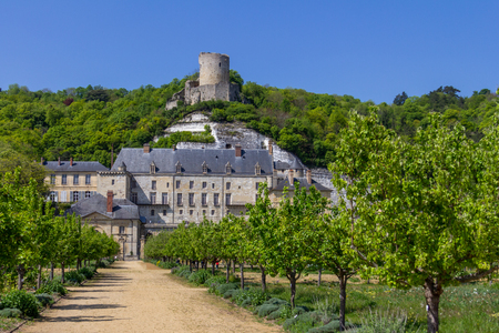 The tower of Chateau de La Roche-Guyon is perched atop the hill above the new chateau and gardenのeditorial素材