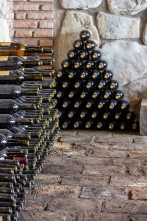 July 6, 2019 - Sekhnika Winery, Kakheti, Georgia - Wine bottles stacked in the wine cellarの写真素材