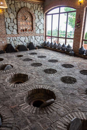 July 6, 2019 - Sekhnika Winery, Kakheti, Georgia - Traditional method of producing Georgian wine in underground clay vessels called qvevri.のeditorial素材